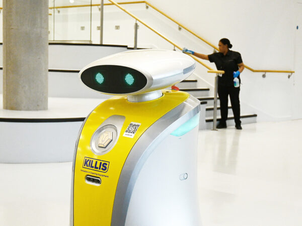 A robotic cleaner working alongisde a NuServe operative.