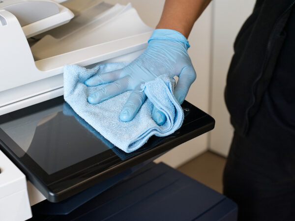 A NuServe cleaner disinfecting IT equipment.