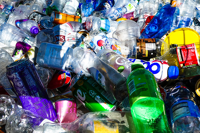 An image of a pile of plastic bottles and cans.