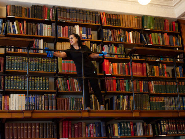 nuserve-b-corp-report-2021-2022 a NuServe cleaner cleaning a library.