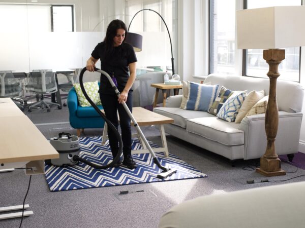 A NuServe operative cleaning carpets.